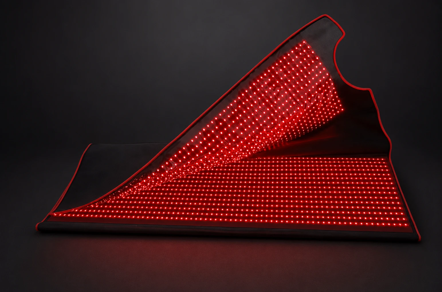 The pod lifting open, its red LED interior spilling out